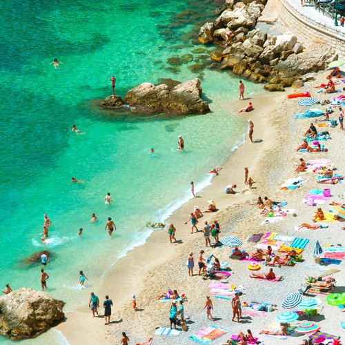 Beach of the Cote d'Azur with Tourists - France Honeymoon Packages