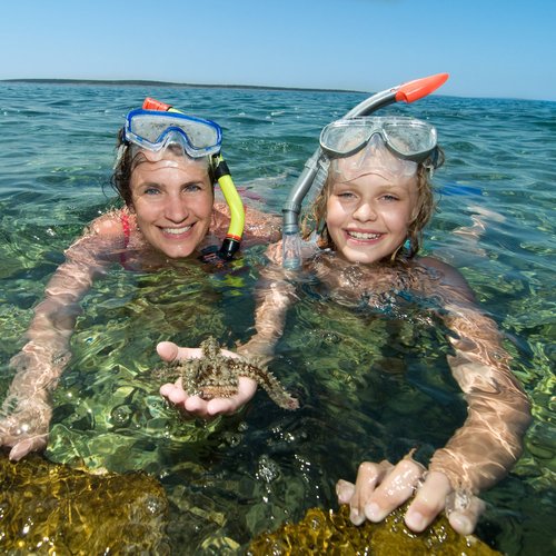 mother and daughter snorkeling in adriatic sea