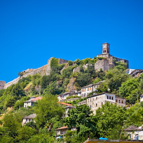 clock tower of the castle on the top hill in gjirokaster