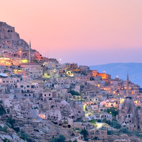 nevsehir cave city in cappadocia, turkey on sunse