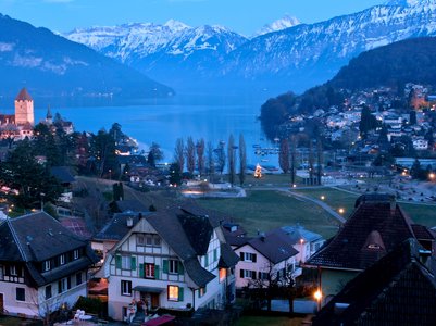 spiez castle and alps night scene switzerland(header ) - Europe Vacation Packages from India