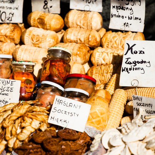 traditional polish smoked cheese oscypek on outdoor market in zakopane 