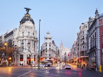 walk long the gran via in madrid 